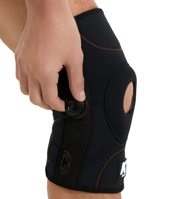 Click and twist mechanism of non velcro tightening knee brace being used.